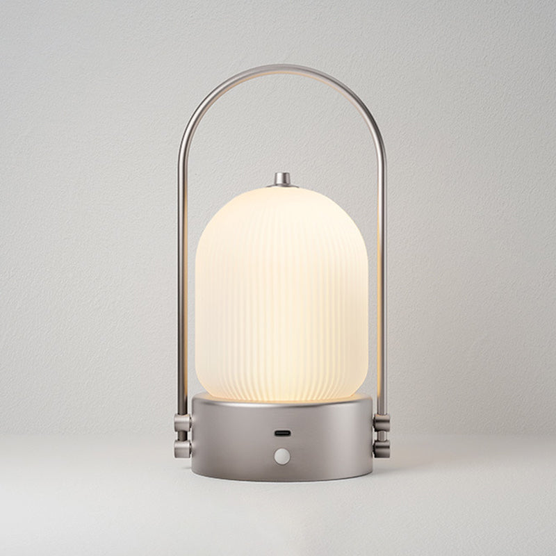 Lámpara de mesa LED USB portátil inductiva de vidrio y hierro metálico ovalado minimalista moderno para dormitorio 
