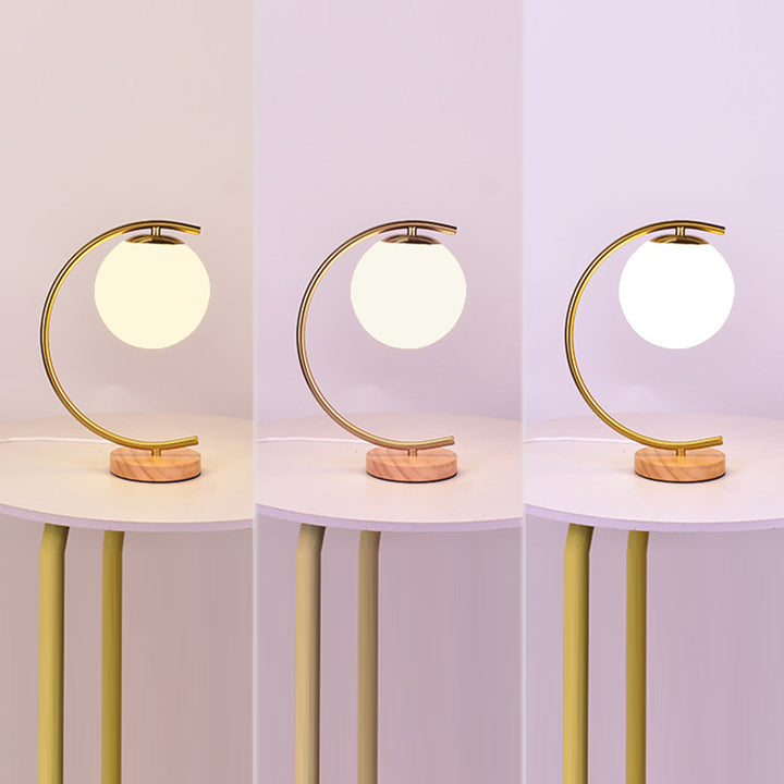 Zeitgenössische skandinavische Kugel gebogene runde Glas Eisen Massivholz 1-Licht Tischlampe für das Wohnzimmer 