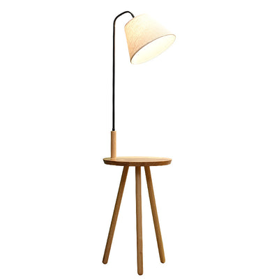Lampe de sol contemporaine scandinave en tissu, fer, bois, à un éclairage, avec forme de triangle, cône, ronde pour salon 