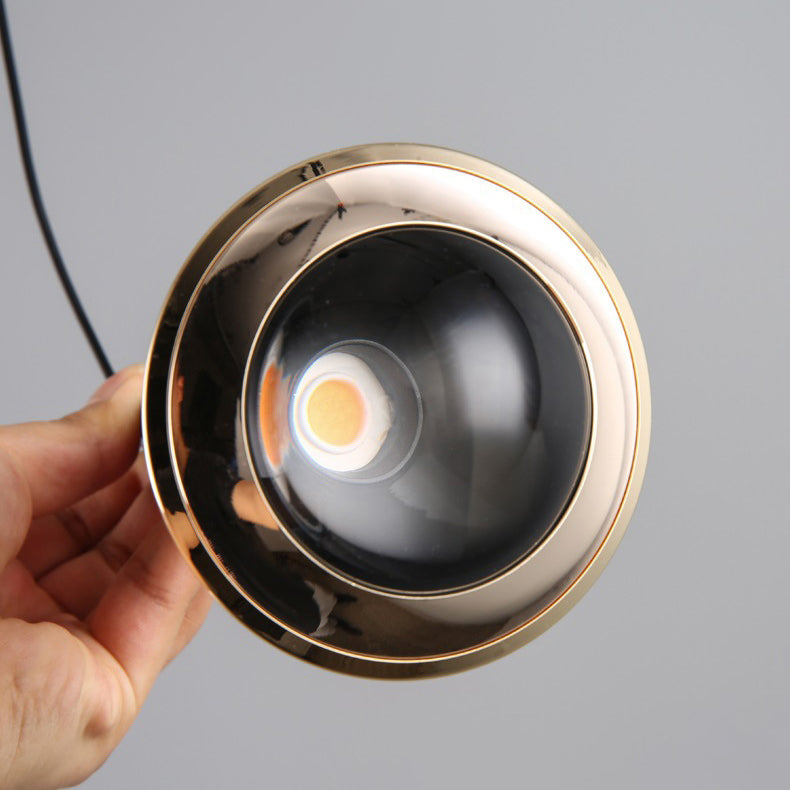 Suspension LED en aluminium avec lentille optique ronde et élévatrice de simplicité moderne pour salon 