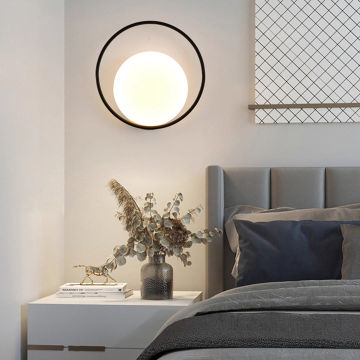 Applique murale LED en fer acrylique ronde contemporaine scandinave pour chambre à coucher 