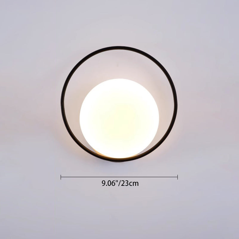 Applique murale LED en fer acrylique ronde contemporaine scandinave pour chambre à coucher 