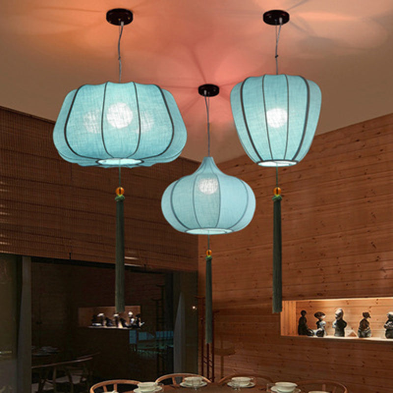 Traditionelle chinesische Laterne aus Eisenstoff in elliptischer Zylinderform mit Quasten, 1/3 Licht Kronleuchter für das Esszimmer 