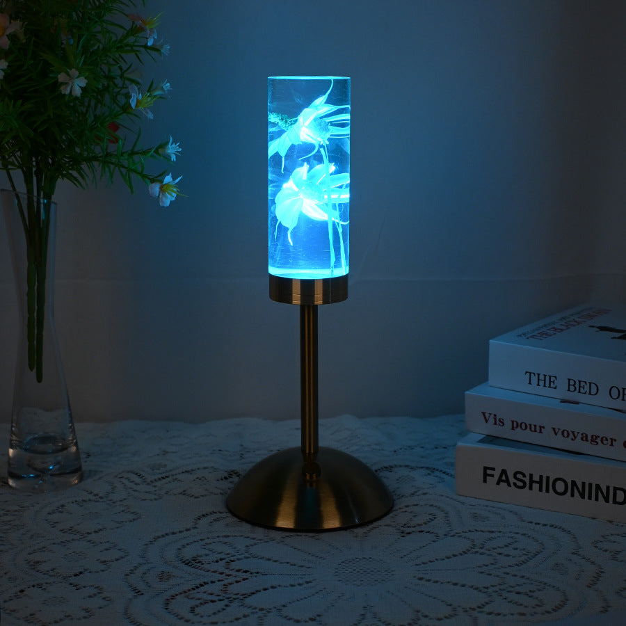 Zeitgenössische kreative USB-wiederaufladbare ewige Blume Gänseblümchen Löwenzylinder Eisen Acryl LED Tischlampe Nachtlicht für den Nachttisch 