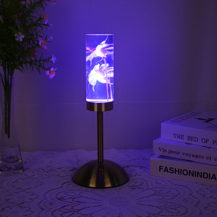 Zeitgenössische kreative USB-wiederaufladbare ewige Blume Gänseblümchen Löwenzylinder Eisen Acryl LED Tischlampe Nachtlicht für den Nachttisch 