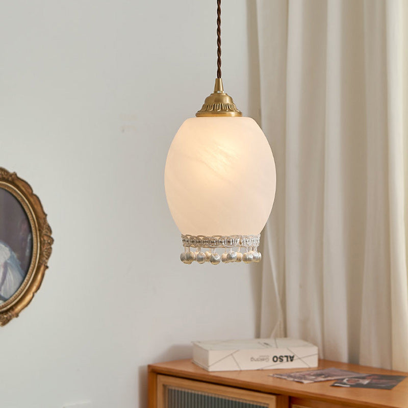 Lámpara colgante de una luz tradicional europea de cobre, vidrio, seda, alambre, borla, cúpula, ovalada para mesita de noche 