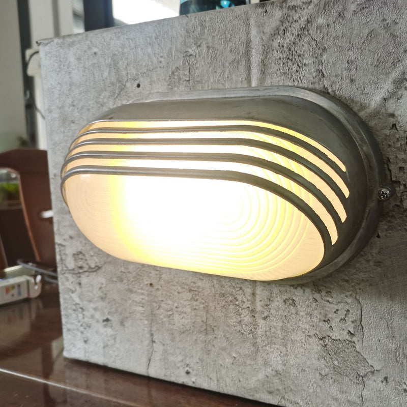 Contemporary Industrial Waterproof Aluminum Glass Frosted Oval Striped 1-Light Wall Sconce Lamp For Outdoor Patio