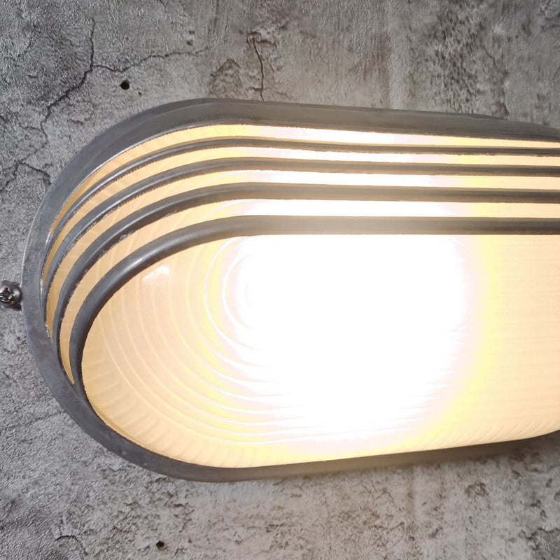 Contemporary Industrial Waterproof Aluminum Glass Frosted Oval Striped 1-Light Wall Sconce Lamp For Outdoor Patio