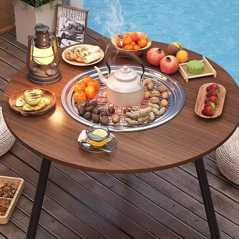Moderner minimalistischer runder Eisen-Holz-Brett-Edelstahl-Außentisch mit 3-beinigem klappbarem Design für den Garten 