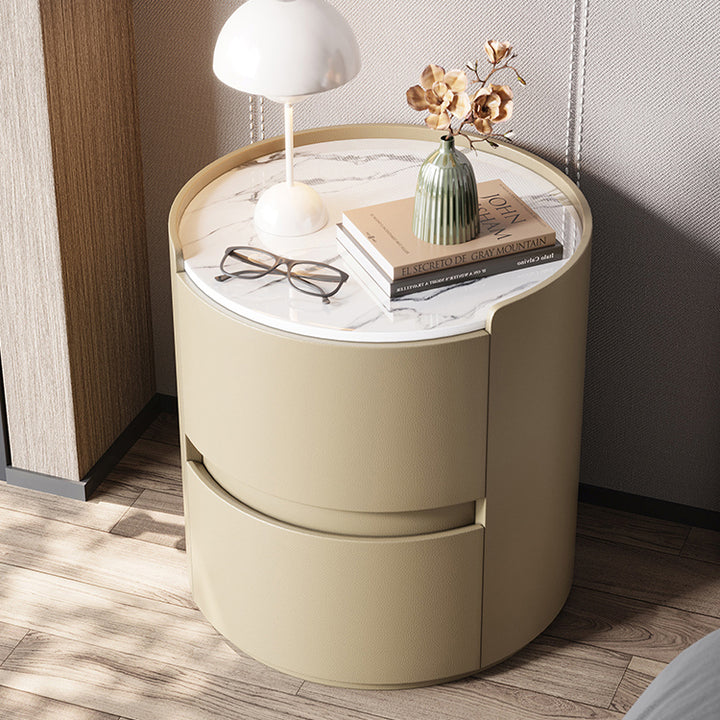 Mesita de noche redonda moderna minimalista de cuero sintético terciopelo con losa de roca y madera contrachapada sólida con 2 cajones para uso junto a la cama 