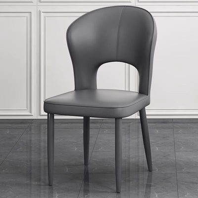Silla de comedor contemporánea escandinava de cuero sintético y acero al carbono, respaldo sin brazos para comedor 