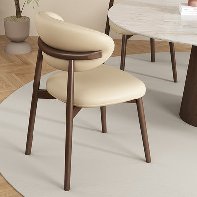 Zeitgenössischer Luxus Esszimmerstuhl mit geschwungener Rückenlehne aus PU-Leder und Carbonstahl für das Esszimmer 