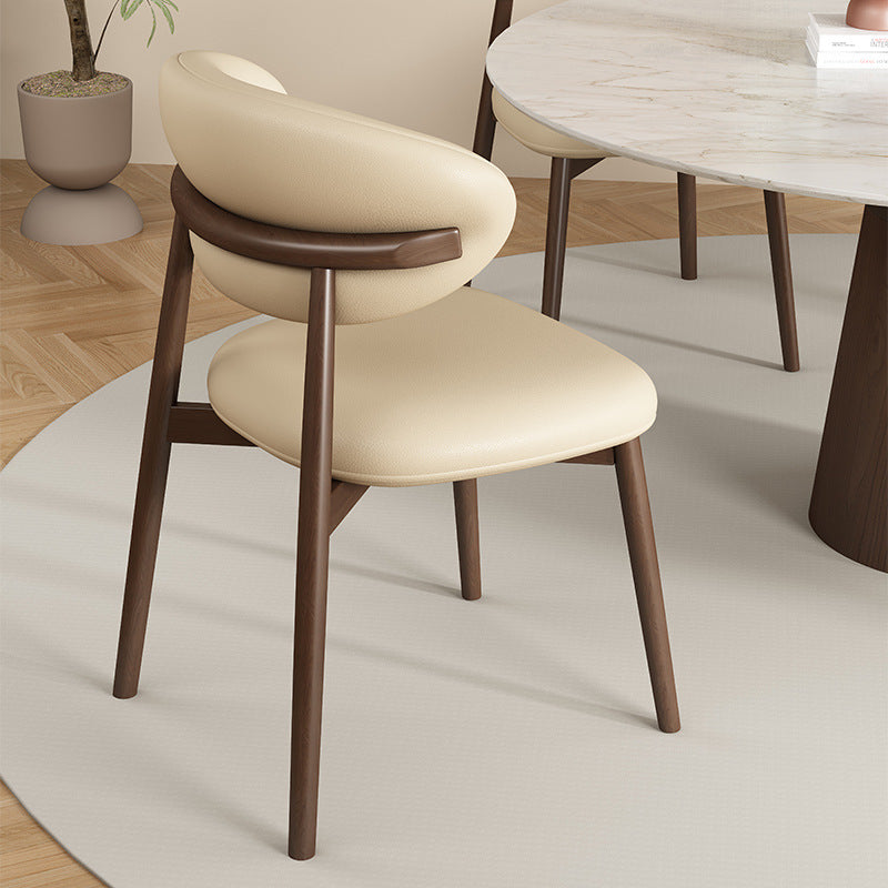 Zeitgenössischer Luxus Esszimmerstuhl mit geschwungener Rückenlehne aus PU-Leder und Carbonstahl für das Esszimmer 