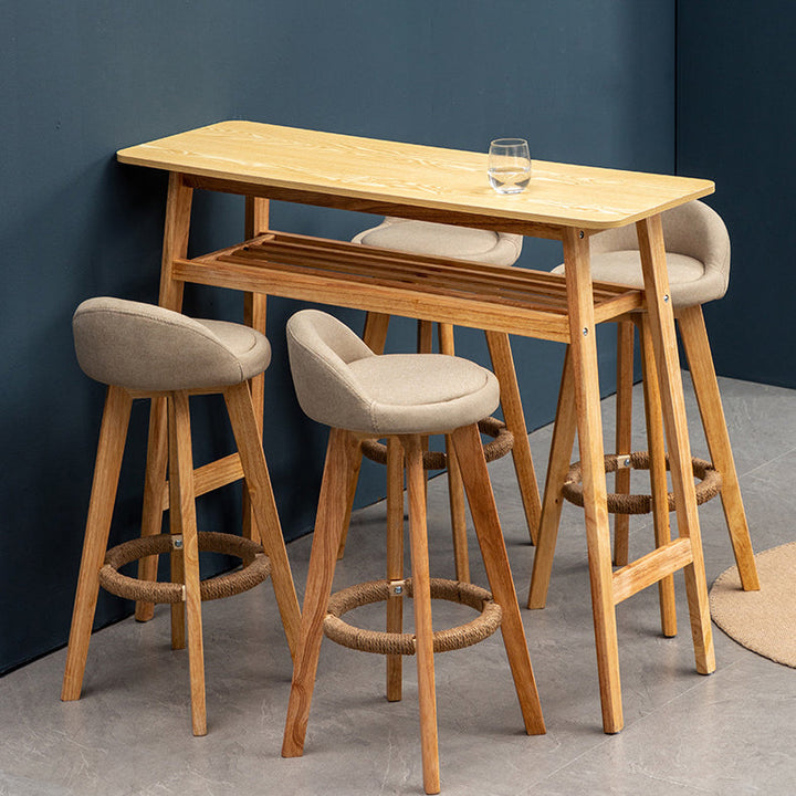 Taburete de bar giratorio contemporáneo nórdico de madera de caucho redonda con respaldo bajo tapizado y reposapiés para comedor 
