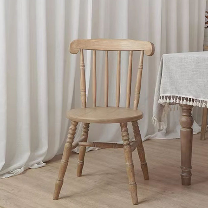Chaise de salle à manger moderne du milieu du siècle en bois massif rond avec dossier à broches et repose-pieds 
