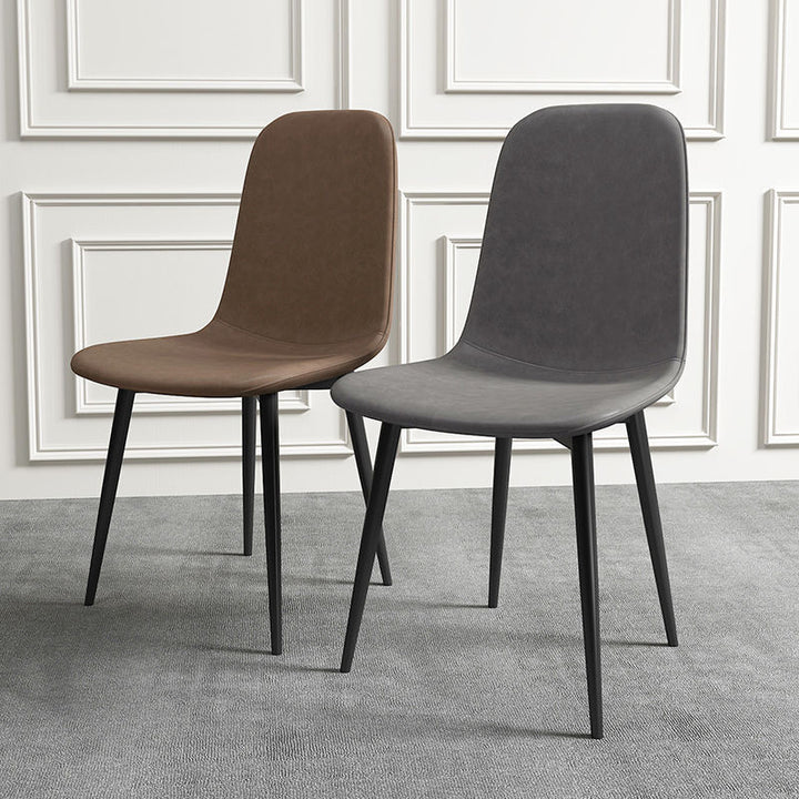Chaise de salle à manger contemporaine en acier au carbone avec revêtement en similicuir incurvé pour salon 