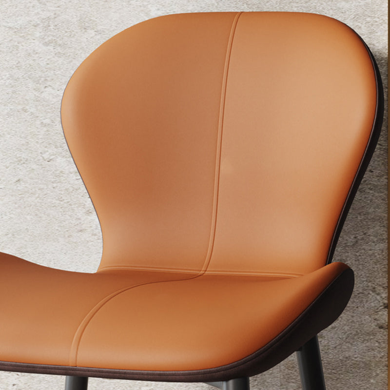 Respaldo de silla de comedor de acero al carbono de cuero con cojín trapezoidal de simplicidad moderna para comedor 