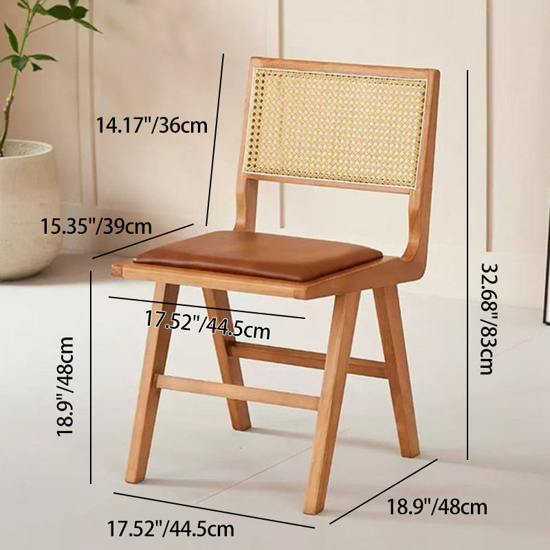 Moderna silla de comedor sin brazos de goma en forma de H nórdica contemporánea con respaldo de ratán tejido y esponja de cuero PU para el comedor 