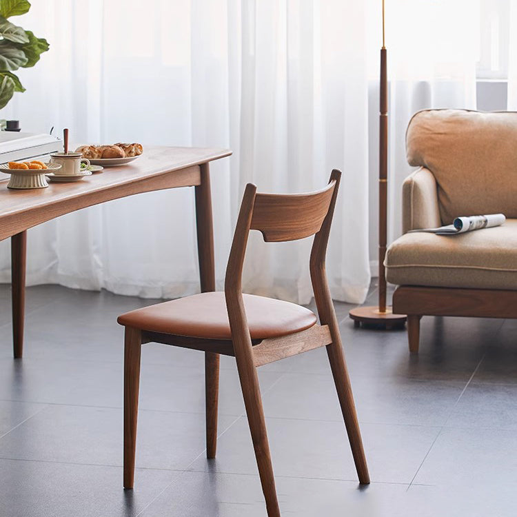 Moderner minimalistischer quadratischer gebogener gepolsterter Kissen-Walnuss-Holz-Esszimmerstuhl Rückenlehne ohne Armlehnen für Esszimmer 