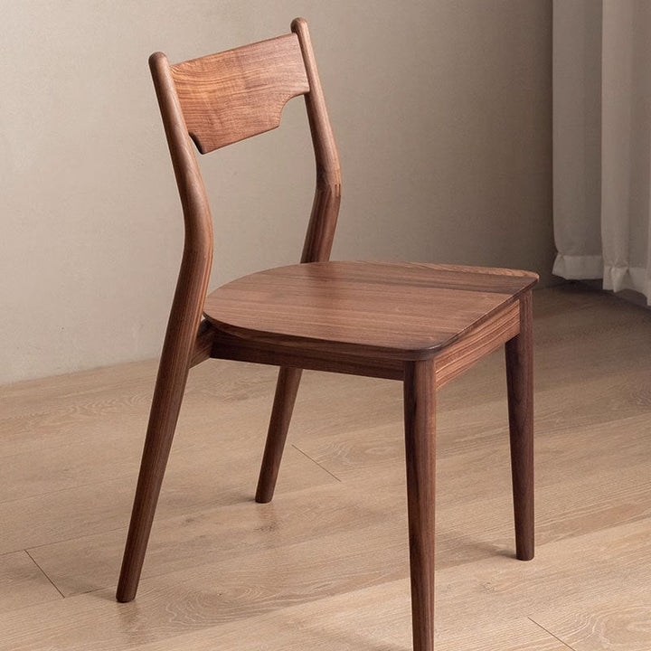 Moderner minimalistischer quadratischer gebogener gepolsterter Kissen-Walnuss-Holz-Esszimmerstuhl Rückenlehne ohne Armlehnen für Esszimmer 