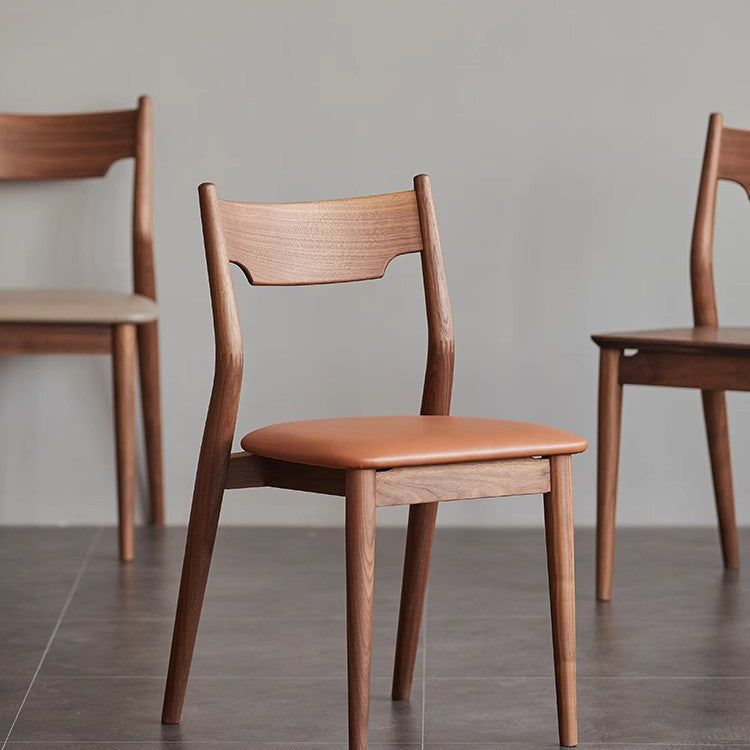Moderner minimalistischer quadratischer gebogener gepolsterter Kissen-Walnuss-Holz-Esszimmerstuhl Rückenlehne ohne Armlehnen für Esszimmer 