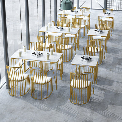 Respaldo de silla de comedor de metal de cuero curvado cuadrado calado escandinavo contemporáneo con brazo para comedor 