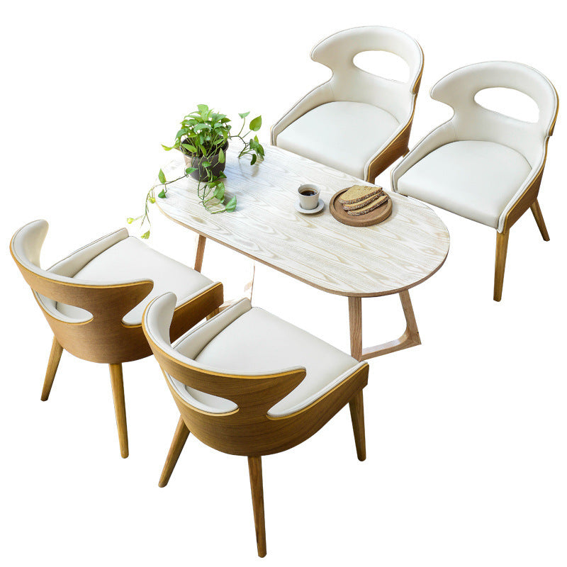 Zeitgenössischer skandinavischer hohler gebogener ovaler PU-Leder Massivholz Esszimmerstuhl Rückenlehne für Esszimmer 