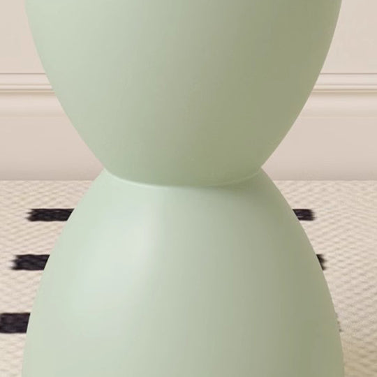Chaise en plastique ronde en forme de sablier minimaliste moderne sans dossier pour salon 