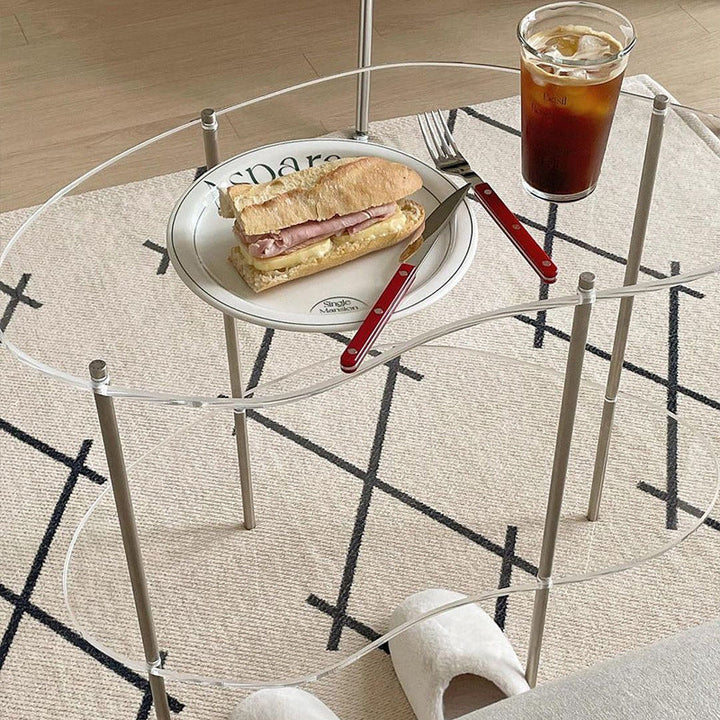 Table basse moderne en métal à deux niveaux avec plateau en acrylique incurvé pour salon 