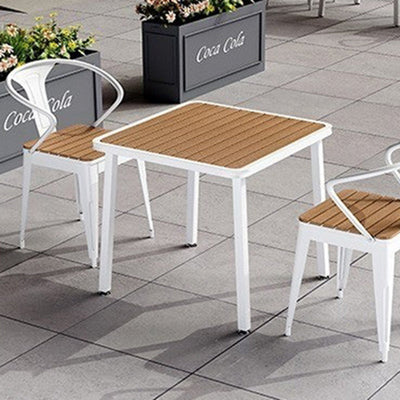 Table à manger moderne minimaliste avec dessus en lattes carrées et cadre en fer pour salle à manger 