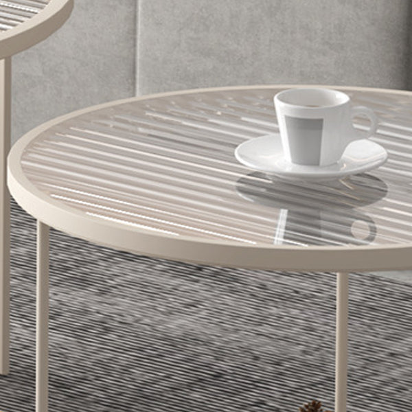 Mesa de centro contemporánea de lujo con tapa redonda de vidrio estriado y estructura de hierro para salón 