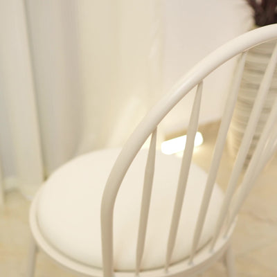 Silla de comedor contemporánea nórdica con respaldo hueco y estructura de acero al carbono tapizada para comedor 