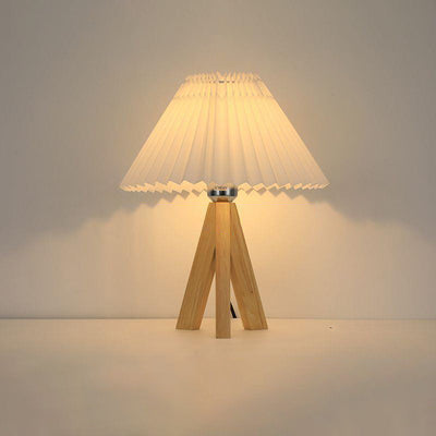 Lámpara de mesa de 1 luz con pantalla de tela plisada trapezoidal minimalista moderna y trípode de madera para dormitorio 