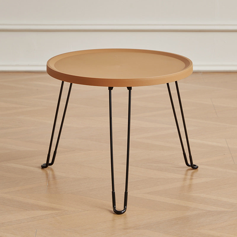 Table basse moderne minimaliste ronde en acier au carbone PP pliable pour salon 