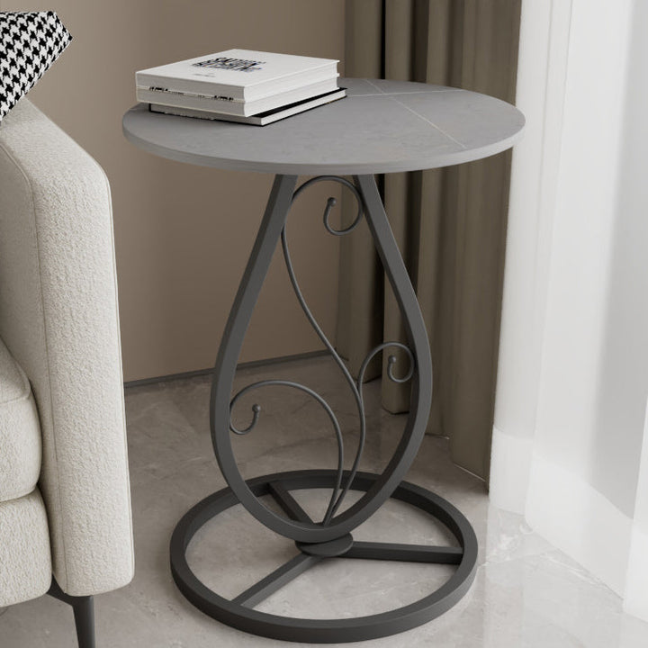 Table basse moderne de luxe ronde avec plateau en pierre frittée et base en métal pour salon 