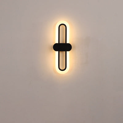 Applique murale LED en fer acrylique ovale de simplicité contemporaine pour salon 
