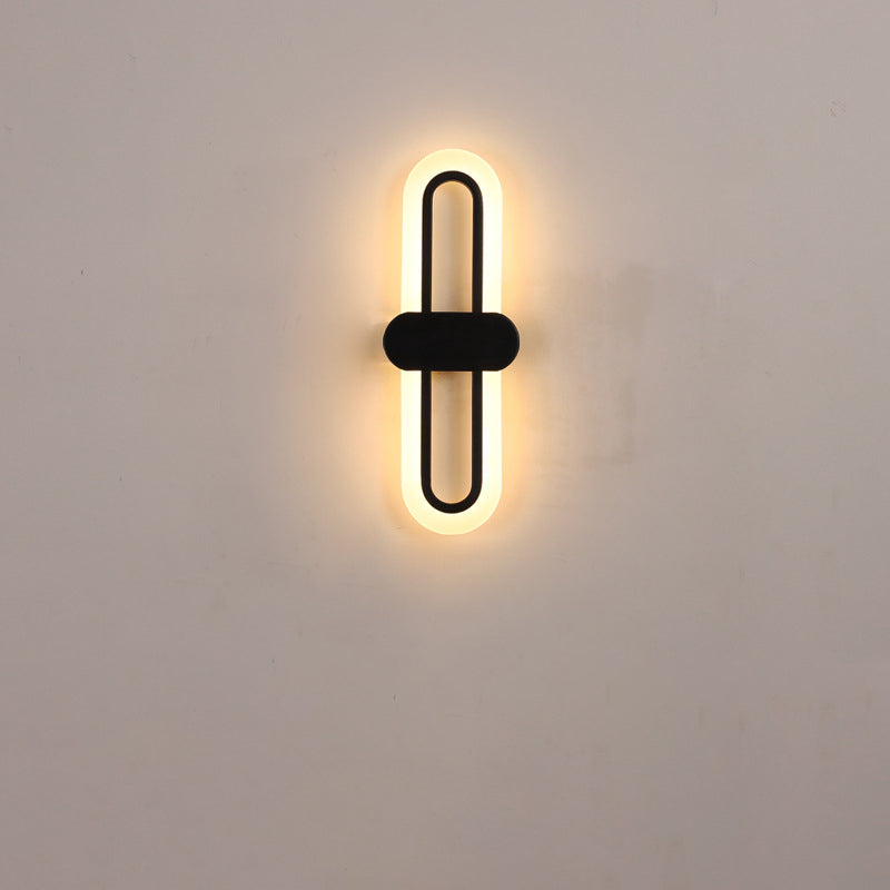 Applique murale LED en fer acrylique ovale de simplicité contemporaine pour salon 