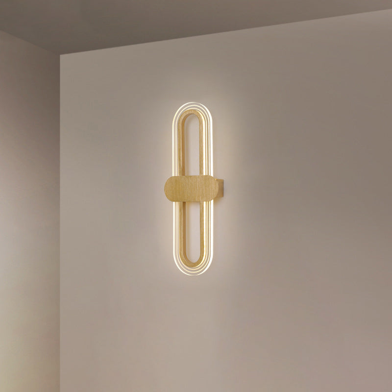 Applique murale LED en fer acrylique ovale de simplicité contemporaine pour salon 
