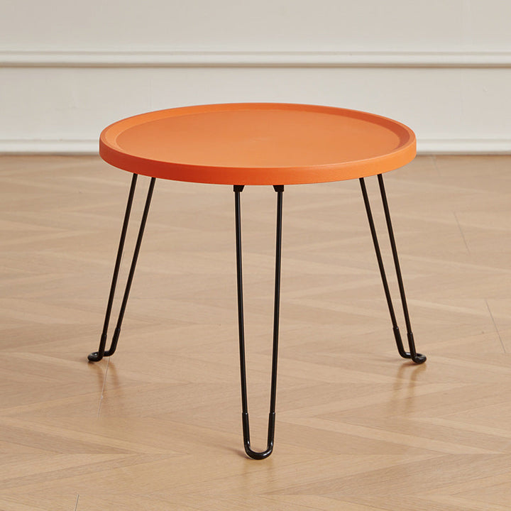 Table basse moderne minimaliste ronde en acier au carbone PP pliable pour salon 