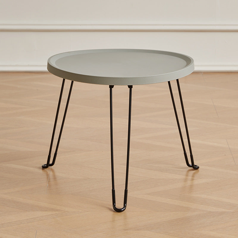 Table basse moderne minimaliste ronde en acier au carbone PP pliable pour salon 