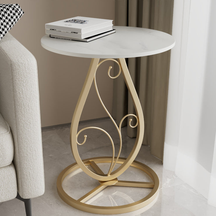 Table basse moderne de luxe ronde avec plateau en pierre frittée et base en métal pour salon 