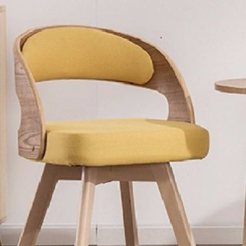 Chaise de salle à manger contemporaine en tissu nordique avec pieds en bois évasés et dossier courbé pour salle à manger 