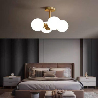 Lustre à 4 lumières avec cadre doré moderne de style mi-siècle et globe en verre pour salon 
