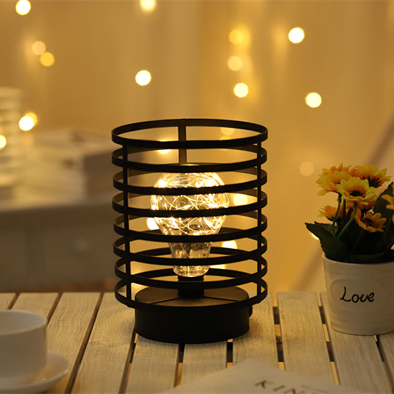Lámpara de mesa de noche LED de batería de hierro con columna redonda simple y creativa 