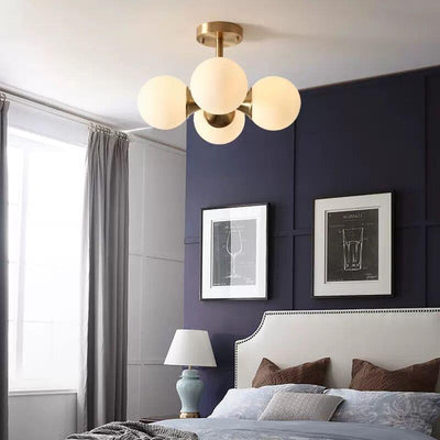 Lustre à 4 lumières avec cadre doré moderne de style mi-siècle et globe en verre pour salon 