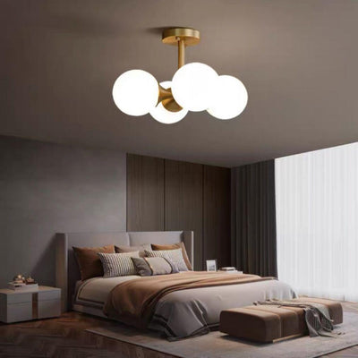 Lustre à 4 lumières avec cadre doré moderne de style mi-siècle et globe en verre pour salon 