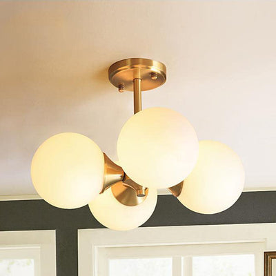 Lustre à 4 lumières avec cadre doré moderne de style mi-siècle et globe en verre pour salon 