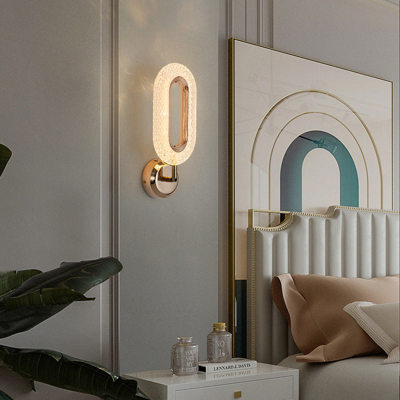 Lámpara de pared LED con pantalla de acrílico y anillo de hierro en oro rosa de lujo moderno para dormitorio 