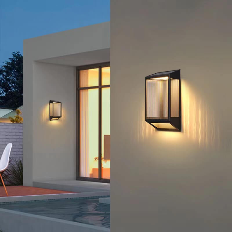 Moderna lámpara de pared solar impermeable trapezoidal de acero inoxidable y acrílico con LED para exteriores 
