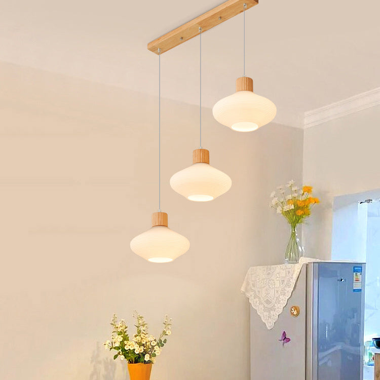 Moderne minimalistische ovale Inselleuchte aus Glas, Gummibaumholz und Metall, 1/3-flammiger Kronleuchter für das Esszimmer 